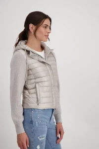 Quilted jacket with knitted sleeves