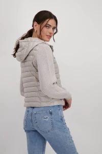 Quilted jacket with knitted sleeves