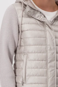 Quilted jacket with knitted sleeves